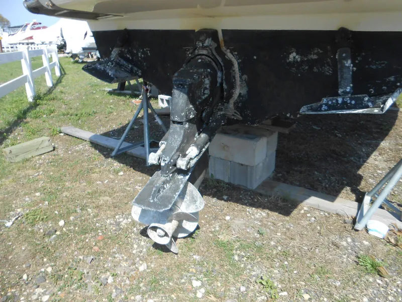 Slide: The Image of 2008 Sea Ray 260 Sundancer boat propeller and stern drive on land. - 24