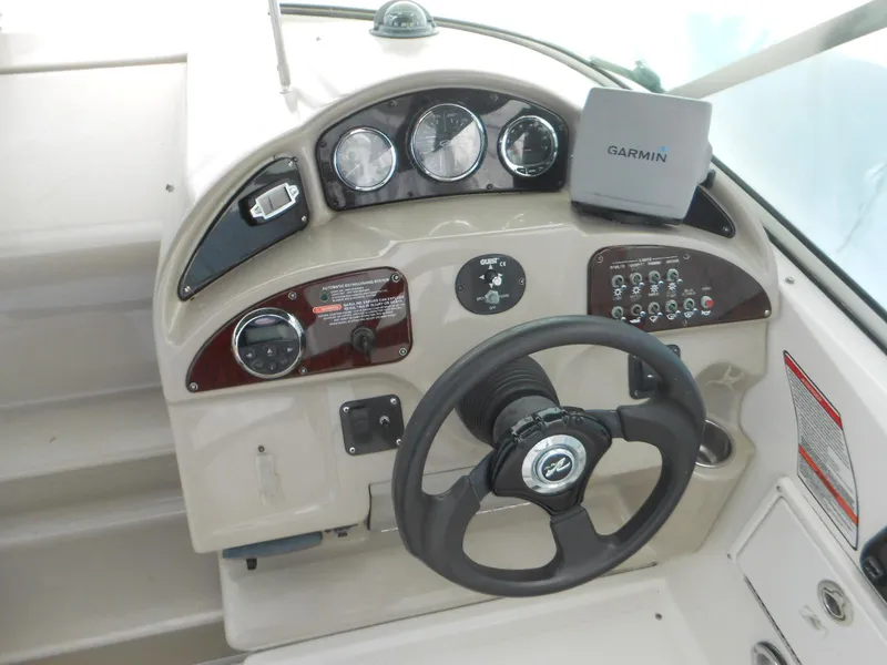 Slide: The Image of 2008 Sea Ray 260 Sundancer helm with Garmin navigation system and instrument panel. - 7