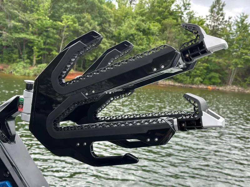 Slide: The Image of 2025 Centurion Ri245 wakeboard rack on a lake with forested background. - 17