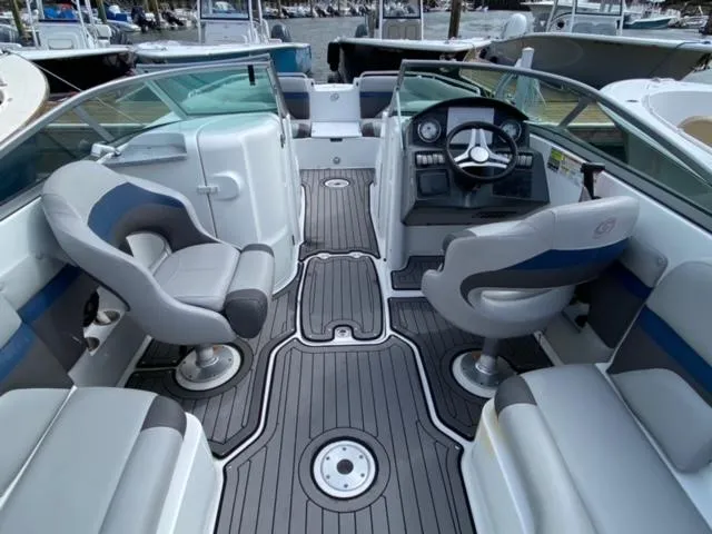 Slide: The Image of 2018 Hurricane SunDeck 2486 OB interior with modern seating and steering console. - 3