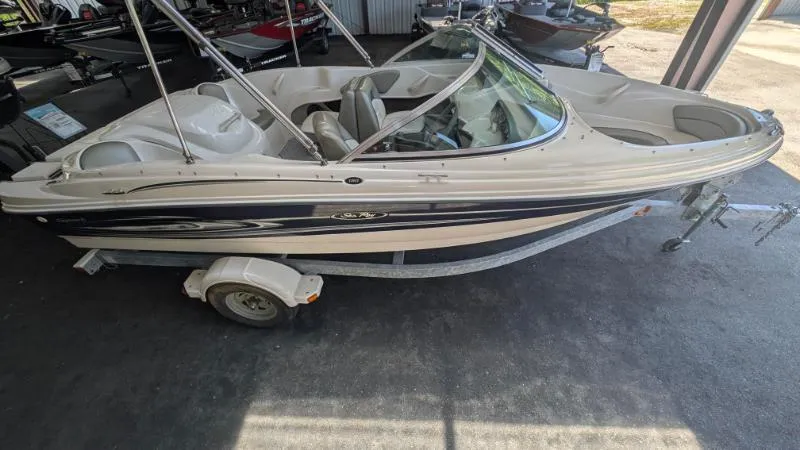 Slide: The Image of 2005 Sea Ray 180 Sport boat on trailer in storage facility. - 10