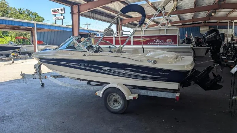 Slide: The Image of 2005 Sea Ray 180 Sport boat on trailer in covered storage area. - 19