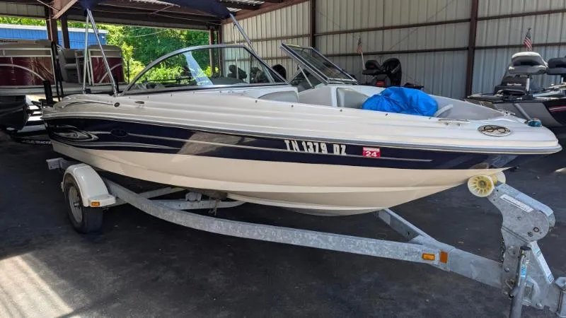 Slide: The Image of 2005 Sea Ray 180 Sport boat on trailer in covered storage area. - 20