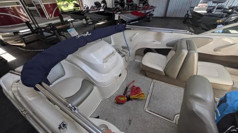 Slide: The Image of Interior of a 2005 Sea Ray 180 Sport boat with seating and accessories. - 8