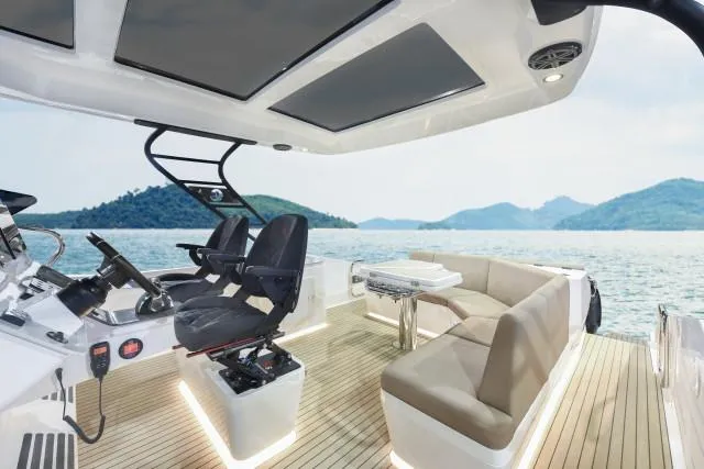 Slide: The Image of Luxurious 2025 Oryx 379 yacht interior with modern seating and scenic ocean view. - 5