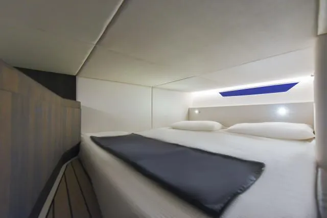 Slide: The Image of Luxurious cabin interior of 2025 Oryx 379 yacht with modern bedding and ambient lighting. - 9