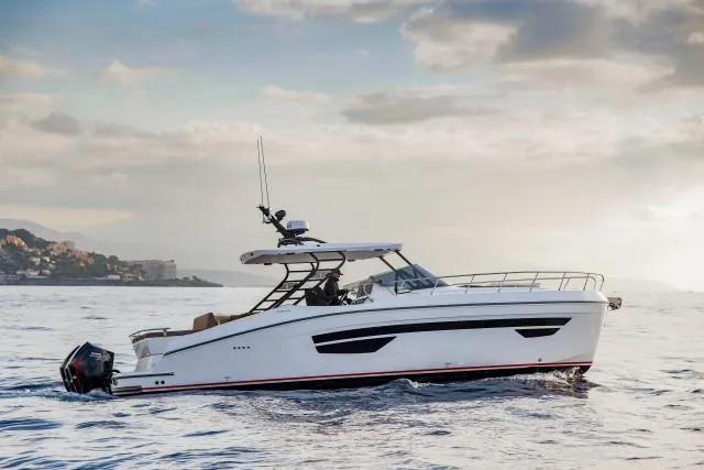 Slide: The Image of 2025 Oryx 379 yacht cruising on open water at sunset. - 3