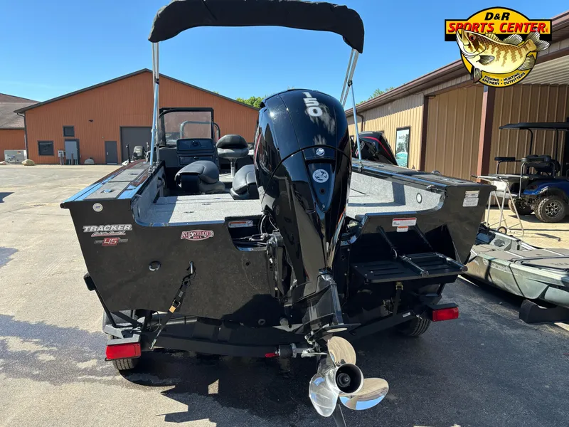 Slide: The Image of 2023 Tracker Targa V-18 Combo boat with outboard motor at dealership. - 4