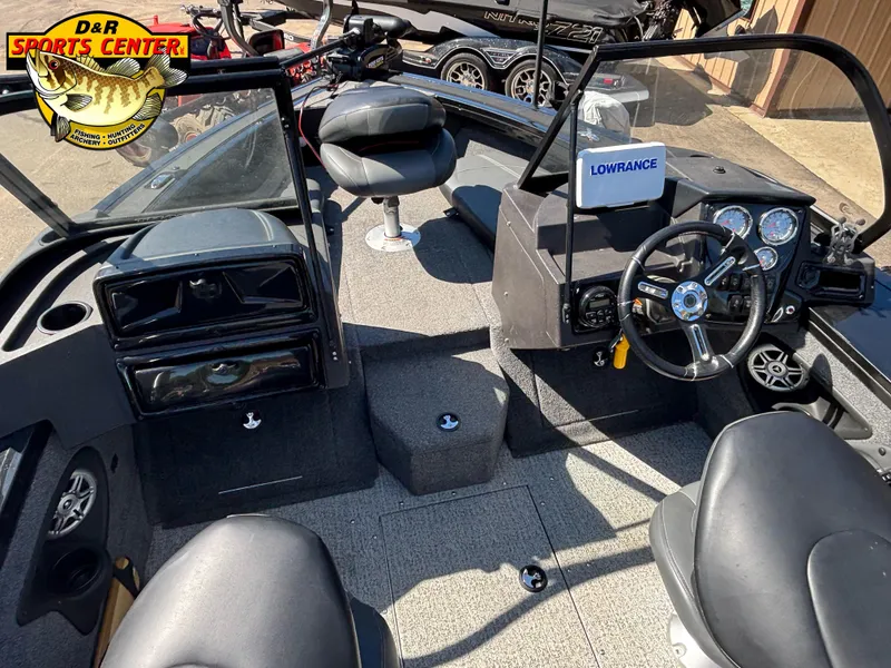 Slide: The Image of 2023 Tracker Targa V-18 Combo boat interior with steering wheel and Lowrance system. - 8