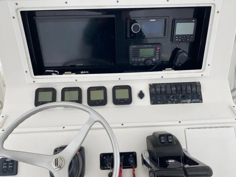 Slide: The Image of 2007 Regulator 29 Forward Seating dashboard with steering wheel and electronic controls. - 10