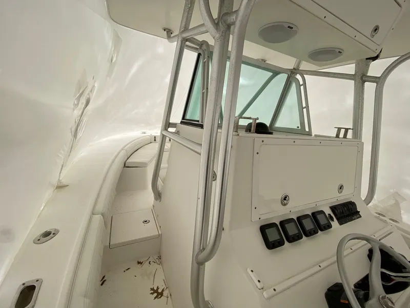 Slide: The Image of 2007 Regulator 29 Forward Seating boat interior with helm and controls. - 16