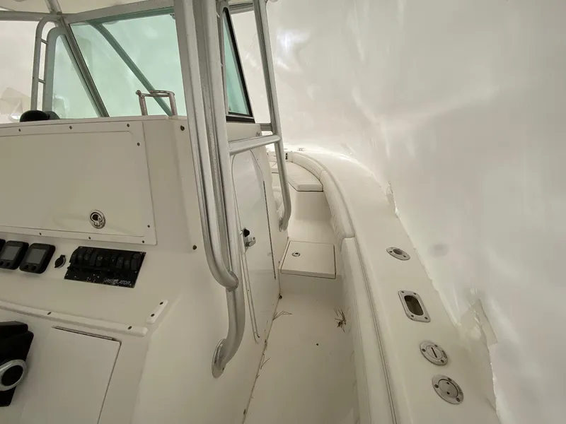 Slide: The Image of 2007 Regulator 29 Forward Seating boat interior with helm and seating area. - 17