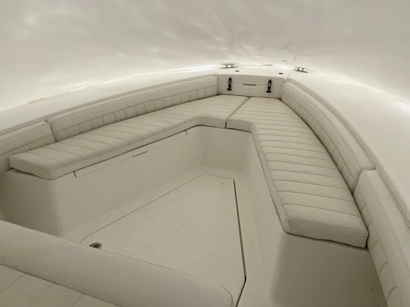 Slide: The Image of 2007 Regulator 29 Forward Seating boat interior with cushioned seating. - 22