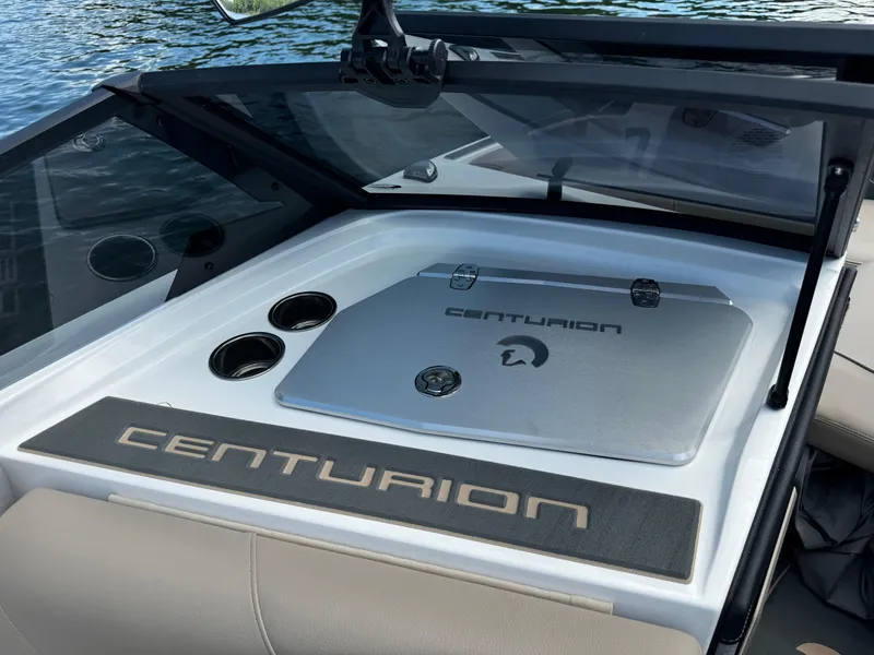 Slide: The Image of 2025 Centurion Fe23 boat interior with logo, cup holders, and sleek design. - 10