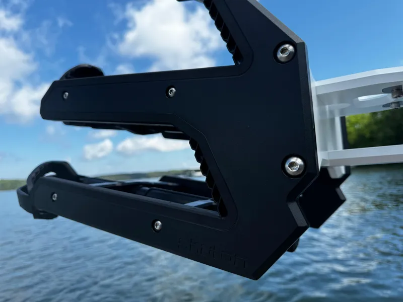 Slide: The Image of Close-up of Centurion Fe23 2025 boat component against a lake and sky background. - 11