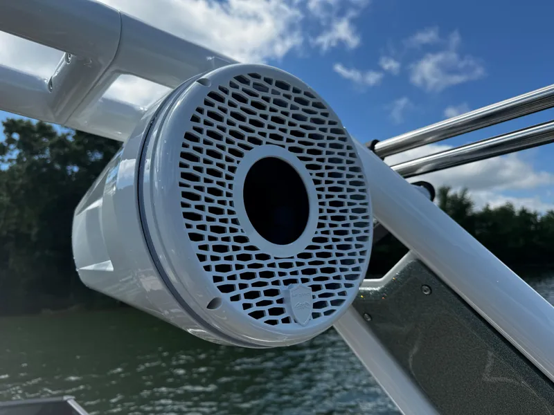 Slide: The Image of Centurion Fe23 2025 boat speaker on a sunny day by the water. - 12