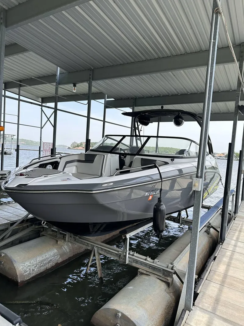 Slide: The Image of 2020 Yamaha AR240 boat docked in a covered marina. - 0