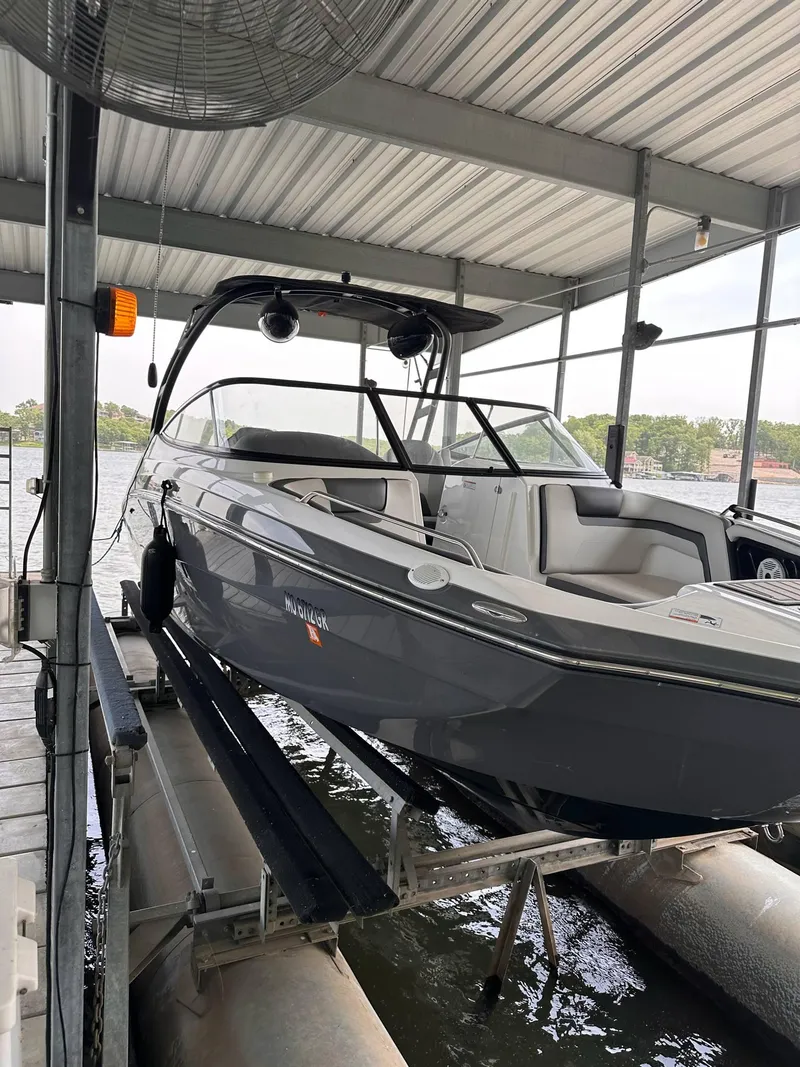 Slide: The Image of 2020 Yamaha AR240 boat on lift under covered dock. - 4