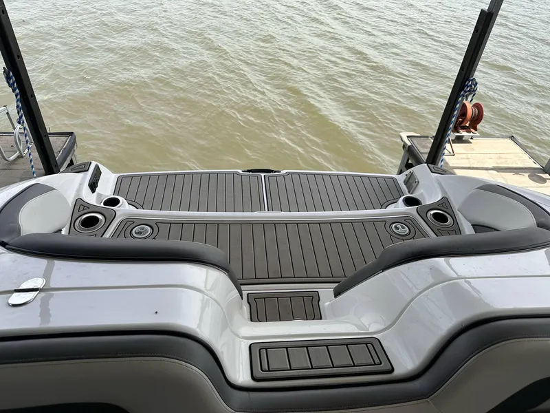 Slide: The Image of 2020 Yamaha AR240 boat swim platform with sleek design and water view. - 9