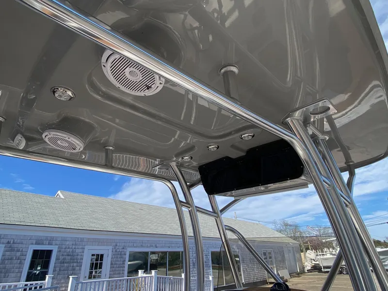 Slide: The Image of 2025 Pioneer 222 Islander boat canopy with speakers and lights, showcasing sleek design. - 8