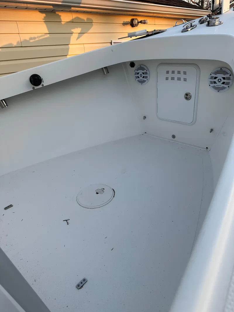 Slide: The Image of 2015 Allied 17 Explorer boat interior with storage compartments and speakers. - 13