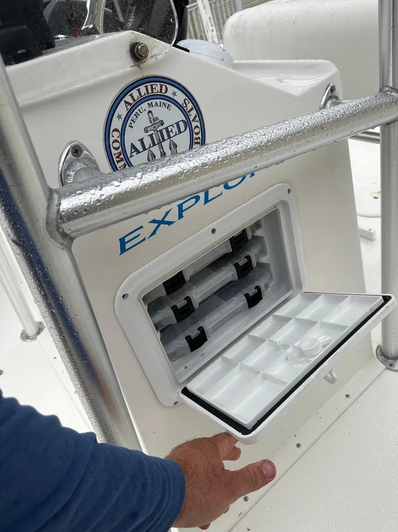 Slide: The Image of 2015 Allied 17 Explorer boat console with storage compartment open. - 20
