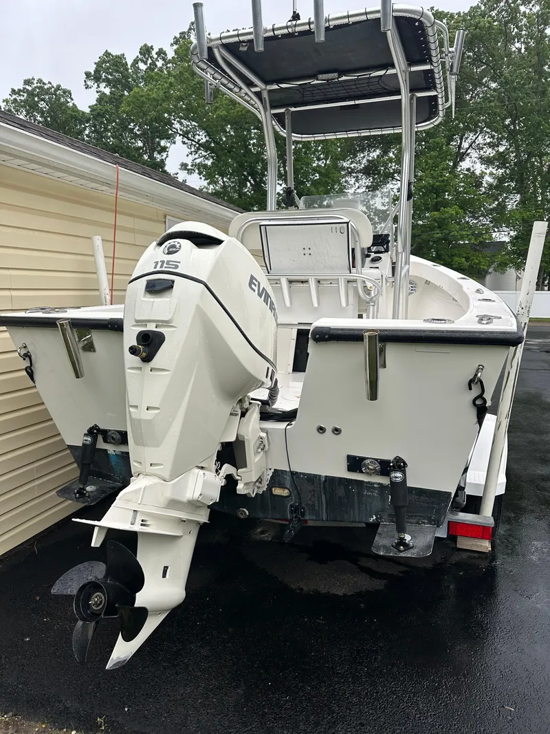 Slide: The Image of 2015 Allied 17 Explorer boat with Evinrude outboard motor, parked on driveway. - 6