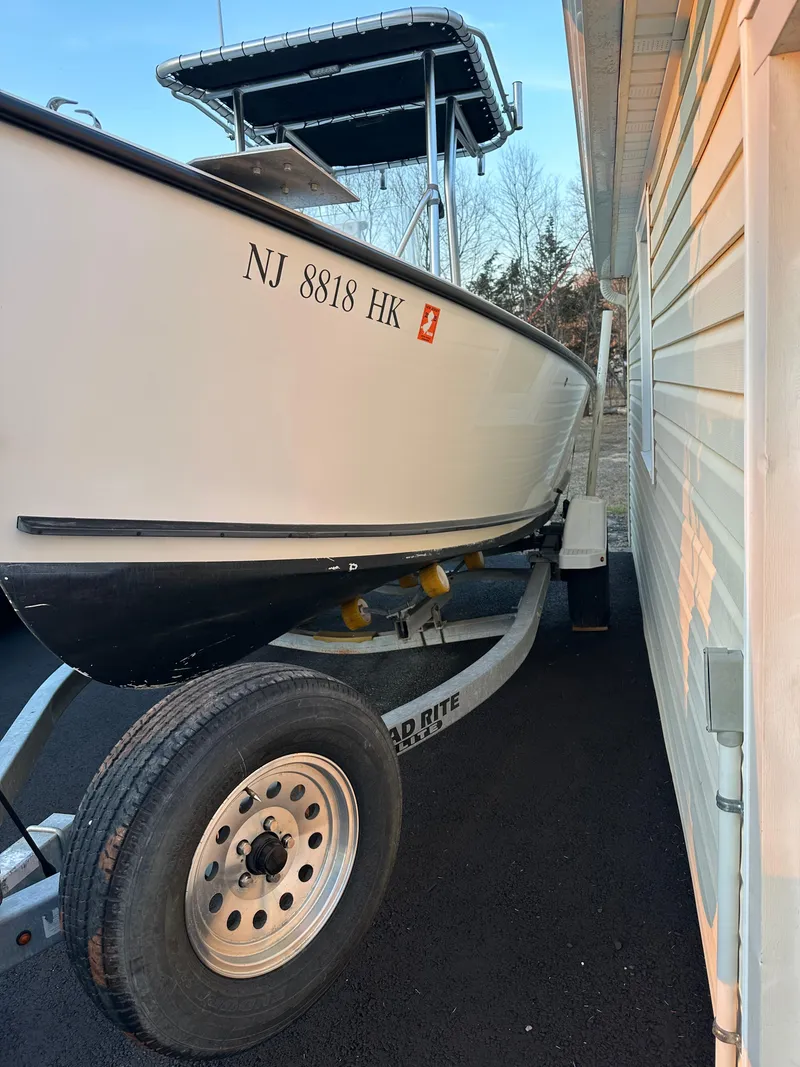 Slide: The Image of 2015 Allied 17 Explorer boat on trailer beside building. - 7