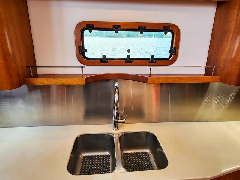 Slide: The Image of Modern kitchen sink on Antares 44i yacht, 2014 model, with stainless steel backsplash. - 20