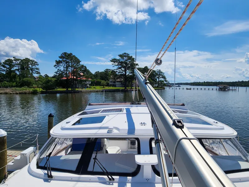 Slide: The Image of Sailing on a 2014 Antares 44i yacht in a serene lake setting. - 35