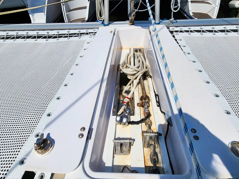 Slide: The Image of 2014 Antares 44i yacht deck with open storage compartment and ropes. - 37