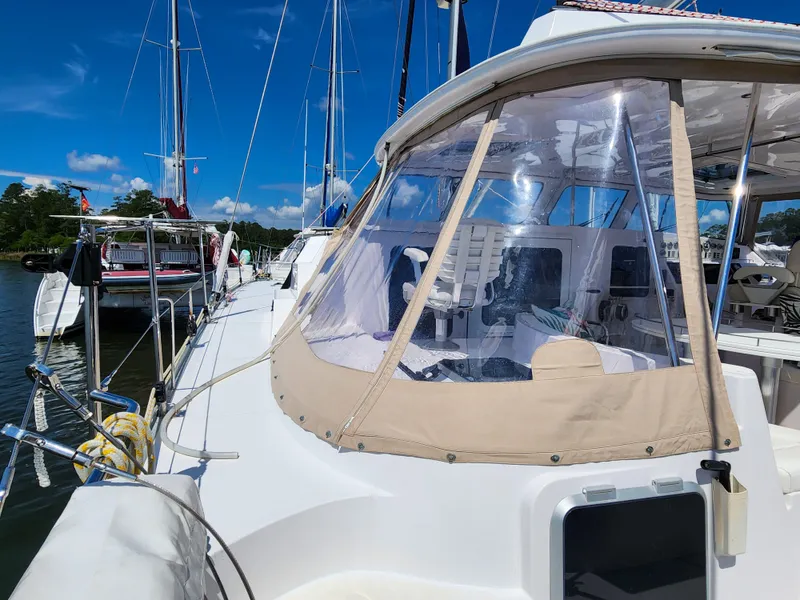 Slide: The Image of Sailing yacht Antares 44i, 2014 model, docked at marina under clear blue sky. - 38