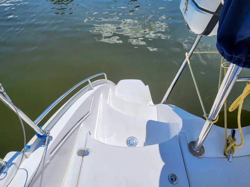 Slide: The Image of Antares 44i 2014 yacht stern view with water reflection and deck details. - 47