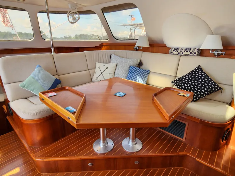 Slide: The Image of Luxurious Antares 44i 2014 yacht interior with elegant seating and wooden table. - 6