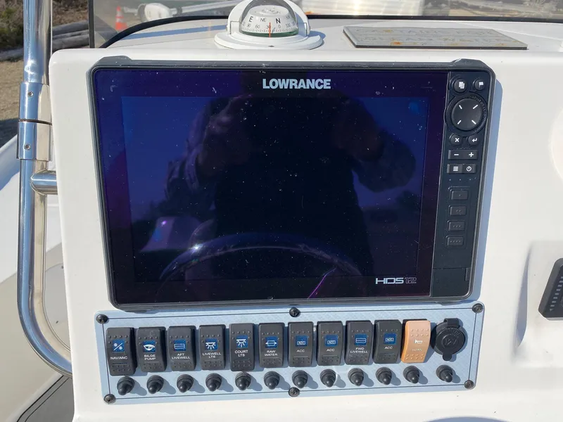 Slide: The Image of Control panel of 2020 Key West 230 Bay Reef with Lowrance HDS display and switches. - 10