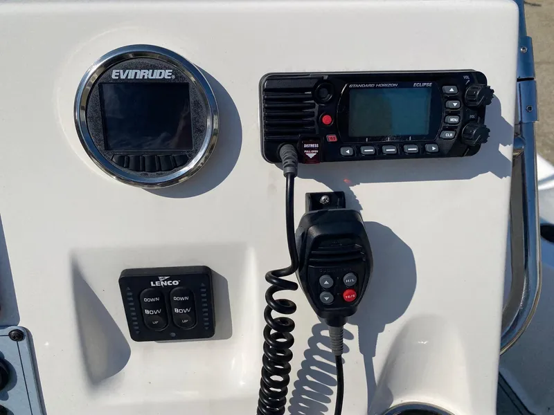 Slide: The Image of Control panel of 2020 Key West 230 Bay Reef boat with Evinrude display and radio. - 11