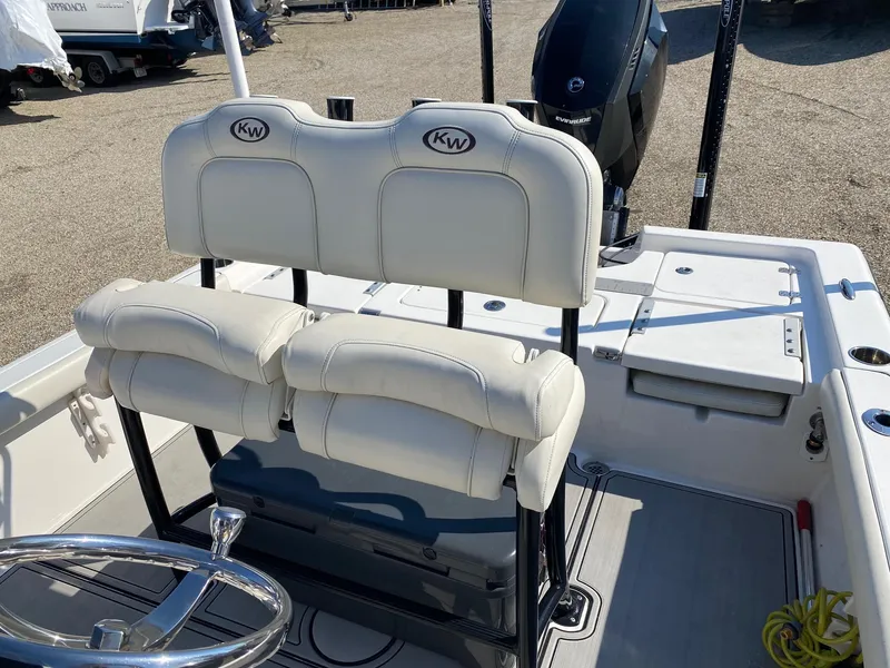 Slide: The Image of 2020 Key West 230 Bay Reef boat interior with dual white cushioned seats. - 14