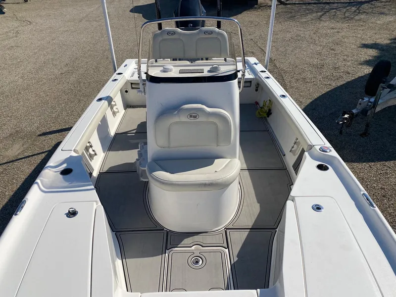 Slide: The Image of 2020 Key West 230 Bay Reef boat interior with seating and console, viewed from above. - 15