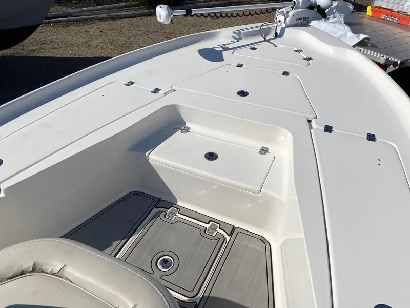 Slide: The Image of 2020 Key West 230 Bay Reef boat deck with storage compartments and seating. - 16