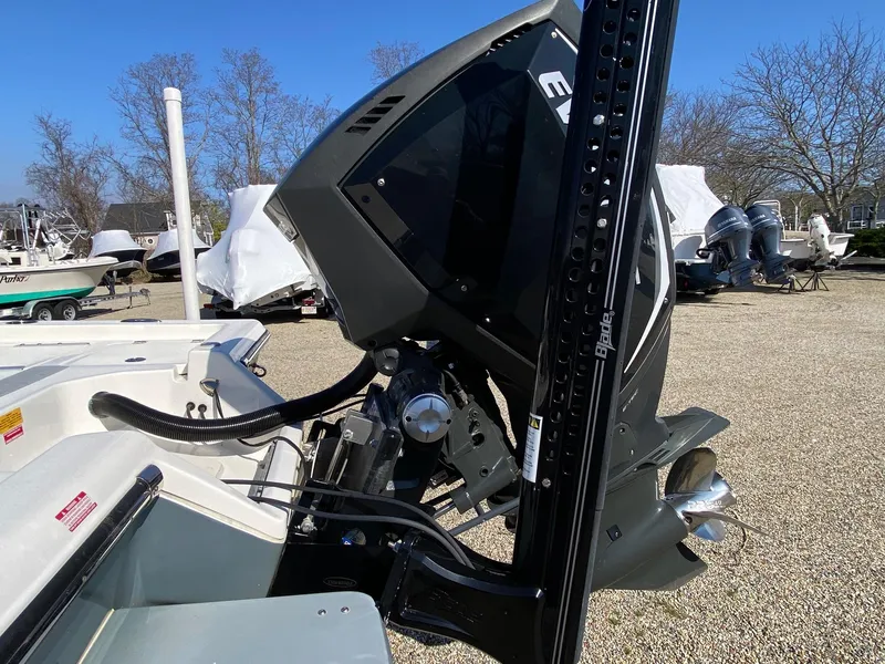 Slide: The Image of 2020 Key West 230 Bay Reef boat engine and propeller in a marina setting. - 4