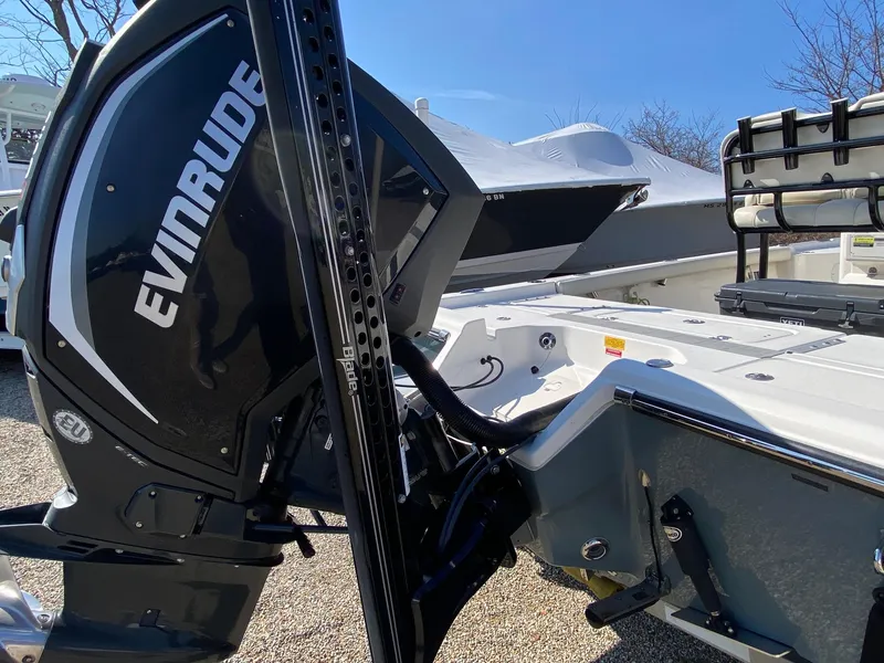 Slide: The Image of 2020 Key West 230 Bay Reef boat with Evinrude engine, outdoor setting. - 5