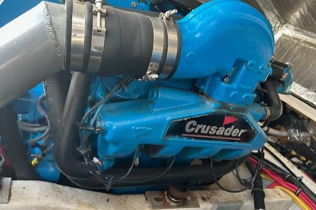 Slide: The Image of Engine of 2004 Tiara Yachts 2900 Coronet with Crusader branding, featuring blue components. - 10