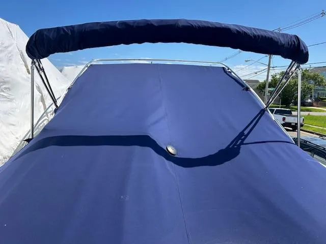 Slide: The Image of 2004 Tiara Yachts 2900 Coronet with blue canvas cover and bimini top. - 12