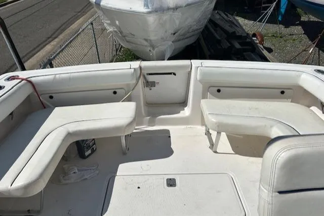 Slide: The Image of 2004 Tiara Yachts 2900 Coronet boat interior with white seating and deck. - 6