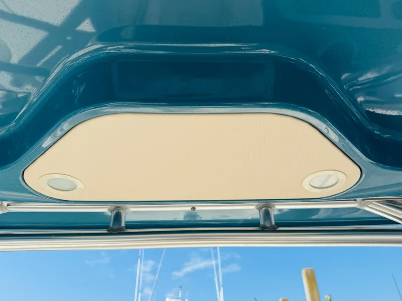 Slide: The Image of 2018 Grady-White Freedom 235 boat ceiling with built-in lights, blue sky background. - 17