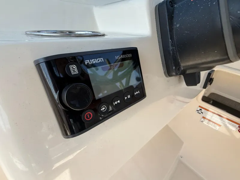 Slide: The Image of Fusion MS-AVX300 audio system on 2018 Grady-White Freedom 235 boat dashboard. - 21