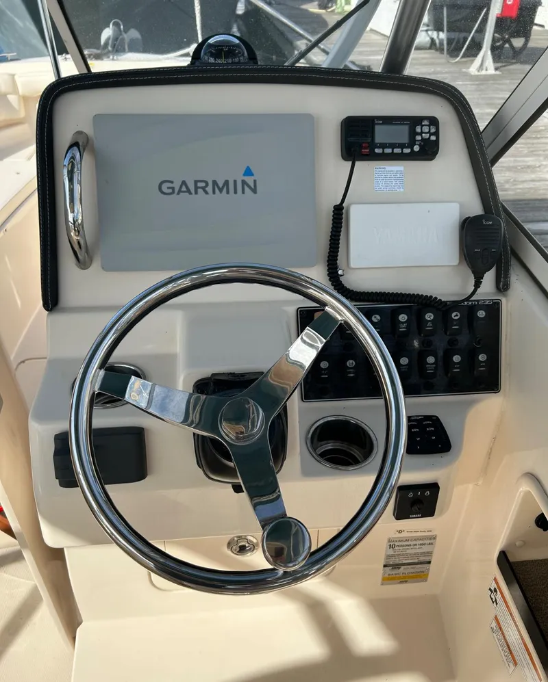 Slide: The Image of 2018 Grady-White Freedom 235 boat dashboard with Garmin navigation system. - 22
