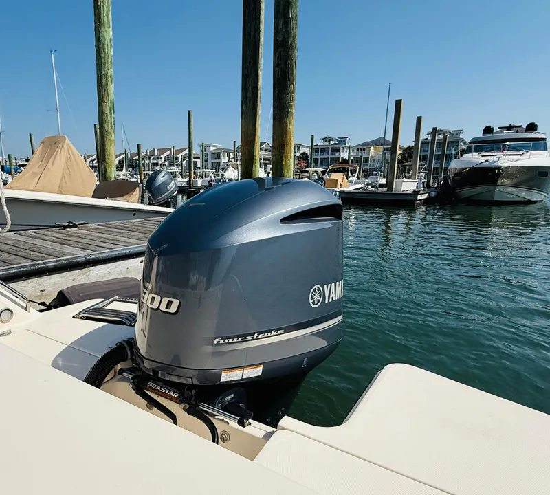 Slide: The Image of 2018 Grady-White Freedom 235 with Yamaha outboard motor docked at marina. - 9