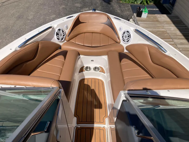 Slide: The Image of 2008 MasterCraft MariStar 215 boat interior with tan leather seating and wood accents. - 18