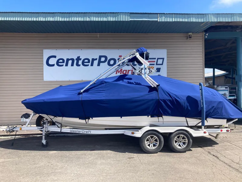 Slide: The Image of 2008 MasterCraft MariStar 215 boat covered, on trailer, outside CenterPointe dealership. - 2
